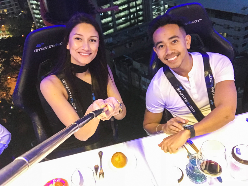 Couple taking selfie in the air at dinner in the sky bangkok