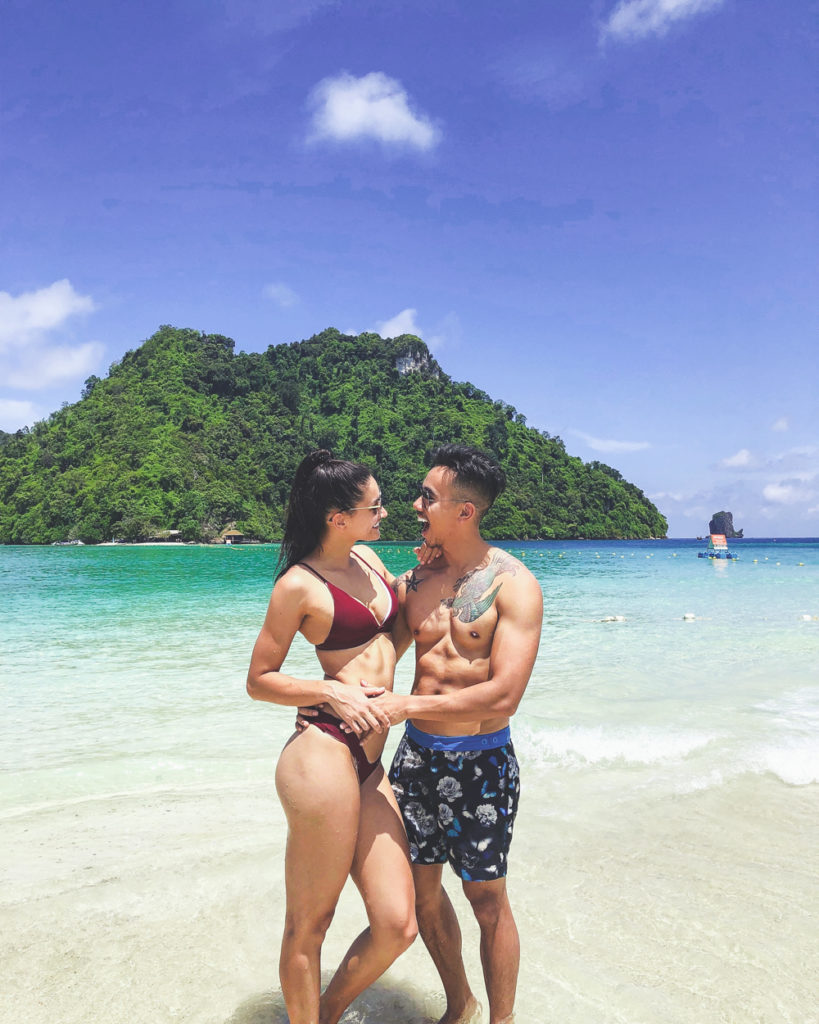 girl looking at her boyfriend on the beach in krabi